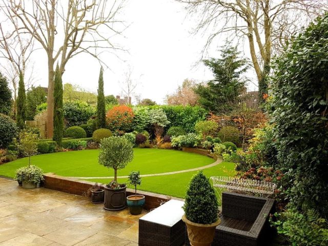 Large back garden of artificial grass.